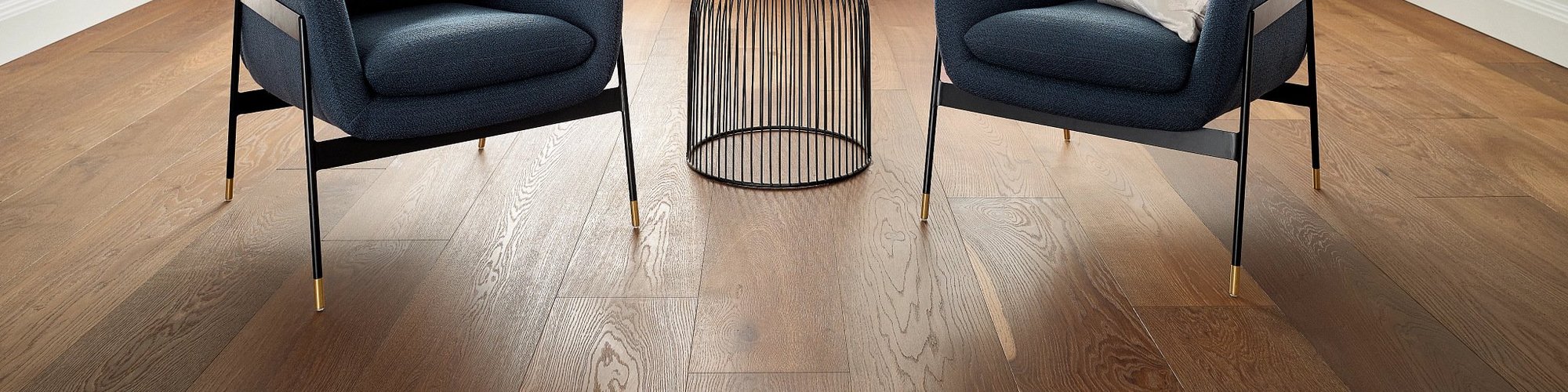 two arm chairs on wood floors - AAAA Flooring